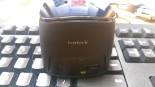 Inateck Portable Bluetooth Speaker on a keyboard