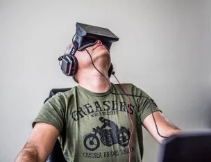 Sergey Orlovskiy using the first version of the Oculus Rift development kit (with separate headphones)