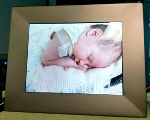 Sleeping baby on the photo frame