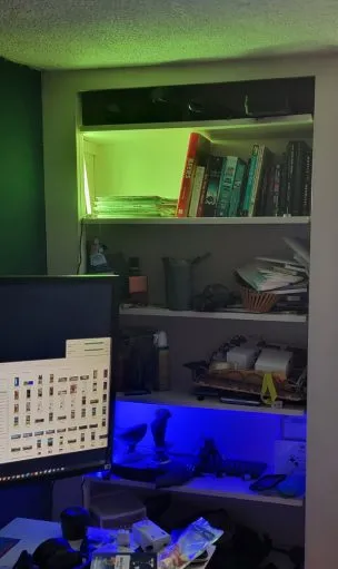 ONFORU LED Smart Ambient Light bars lighting up a couple of the shelves I have