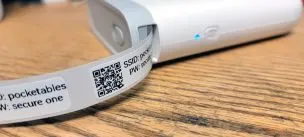 Niimbot D11 label maker printing up tiny little QR codes with Wi-Fi connection information